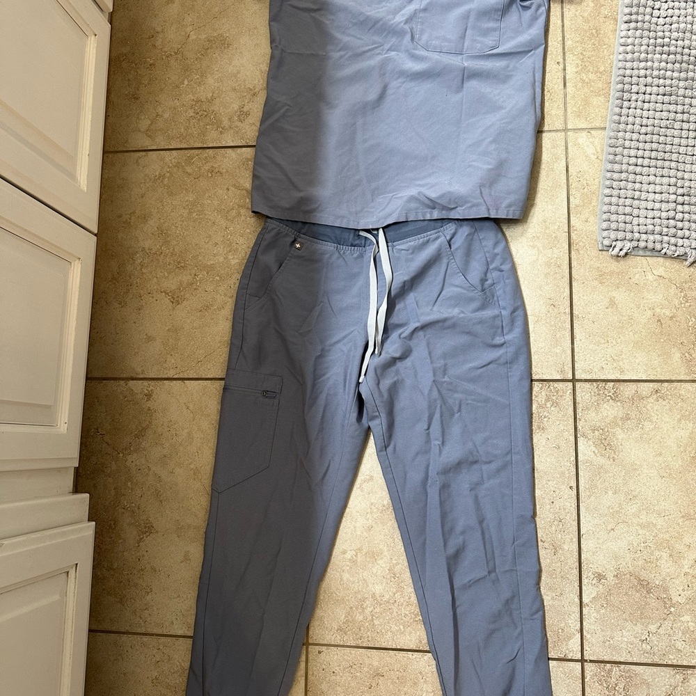 Figs light blue/grey. Worn once maybe twice